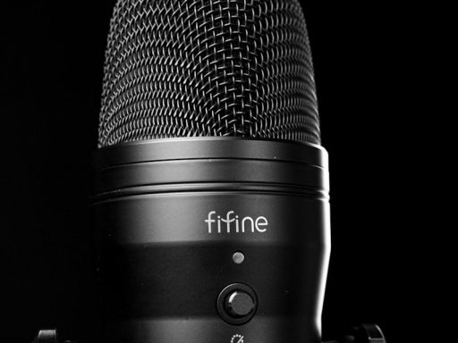 A black microphone with a black background