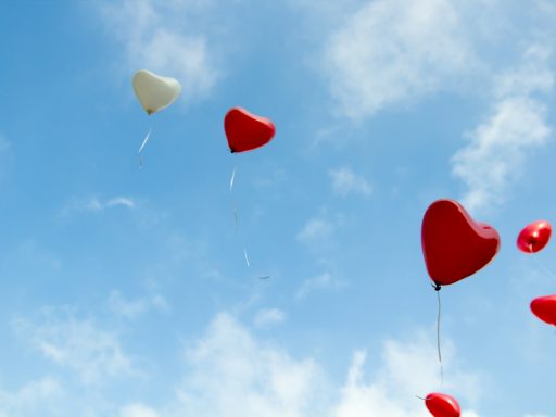 red and white heart balloons