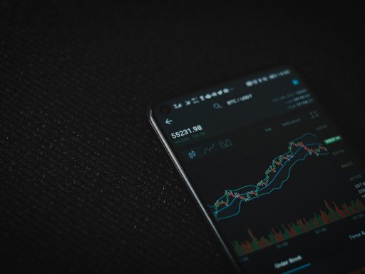 black android smartphone on black textile