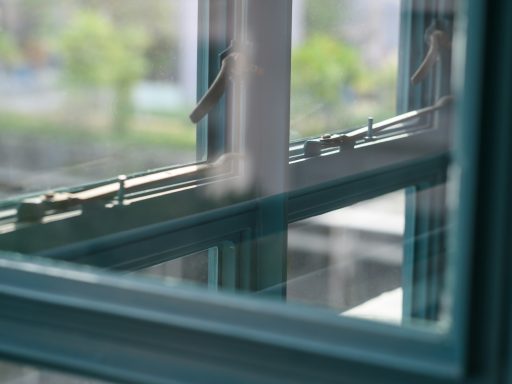 grey metal framed glass window closed