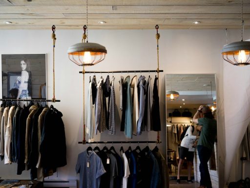 clothing boutique interior with hanging racks